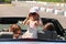 Father, mother and daughter ride in car