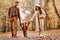 Father and mother with son walking in the autumn Park. A family walks in the Golden autumn in a nature Park.