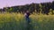 Father played with the baby in the rapeseed field and throws it Slow motion