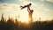 father playing with son in the park. dad throws baby up into the sky silhouette in the field in nature in the park