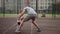 Father plays basketball tricking excited son on court against football field