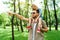 father pointing on something to son sitting on shoulders