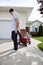 Father Pulling Son Sitting in Wagon