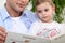 Father reading daughter a story