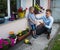 Father reprimands son for breaking flowerpot with ball
