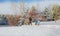 Father rides children on a sled. Walking on a frosty winter day in nature with family