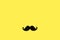 Father`s day concept. Black moustache paper background