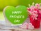 Father`s day concept. Poster mock up template with flower bouquet, marshmallow in the shape of heart and books over green backgro