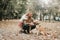 Father`s day. Happy family daughter hugging dad and laughs outdoor in park. Father and daughter with their lovely dog playing in