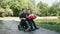 father's day. little cute boy sits on his father's lap with gifts in his hands. a man is a person with disability