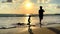 Father's Day. Silhouette of an Asian father and son opposite the sunset engaged in fishing. Bali, Indonesia, July 3