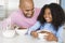 Father Sitting With Daughter at Breakfast