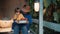 Father and small child eat fresh, organic vegetables from farm sitting on porch