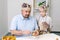 Father and son 7-8 years old prepare cookie dough for the holiday.