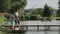 Father and son angling with spinning rod at lake