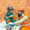 Father and son. Builders. Tools at a construction site. Hard work. Salary. Family business. Construction firm. New