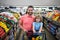 Father and son buy fresh vegetable in grocery store. Family in shop.