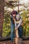 father and son chopping firewood with axe