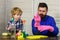 Father and son cleaning. Dad teaching kid little boy use disinfectant spray cleaning and washing dust while cleaning