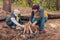 father and son collecting firewood and kindling bonfire