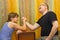 Father and son compete in arm wrestling