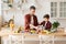 Father and son cooking dinner standing on kitchen