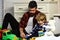 Father and son create toys from bricks. Dad and kid build of plastic blocks. Family daddy child leisure game. Loving dad