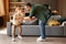 Father and son dancing with music together at home