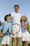 Father with Son and Daughter on Tennis Court