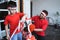 Father and son decorating bicycle for competition in indonesia independence day