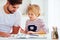 Father and son at the desk, educating at home