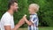 Father and son eating icecream together