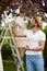 Father and son enjoy picking cherries in garden