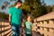 Father and son enjoying company, talking, having fun in nature on sunny day. Parenthood, lifestyle, parenting, childhood