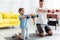 Father with son exercising with dumbells