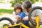 Father and son fixing bike