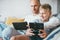 Father and son game players funs sit together using the tablet a