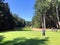 Father and son golfing surrounded by lakes and forest on a beautiful summer day along the sunshine coast, British Columbia