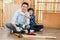 Father and son happily helped to do woodwork at home