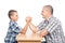 Father and son having fun with arm wrestling