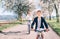 Father and son having fun when riding bicycles on country road under blossom trees. Healthy sporty lifestyle concept image