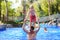 Father and son having fun in swimming pool