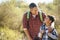 Father And Son Hiking In Countryside