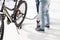 Father and son inflating bicycle tire with pump o