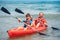 Father and son kayaking in ocean. Active vacation with young kid. Holiday activity with schoolboy child