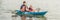 Father and son kayaking at tropical ocean. BANNER, long format