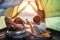 Father and son lie together in touristic tent and enjoy with sun