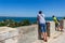 A father and son look at the summer landscape with a view of the seaport and the city of Kerch from mount Mithridates.