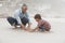 Father And Son Making Sand Castle