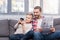 Father and son with newspaper and smartphone